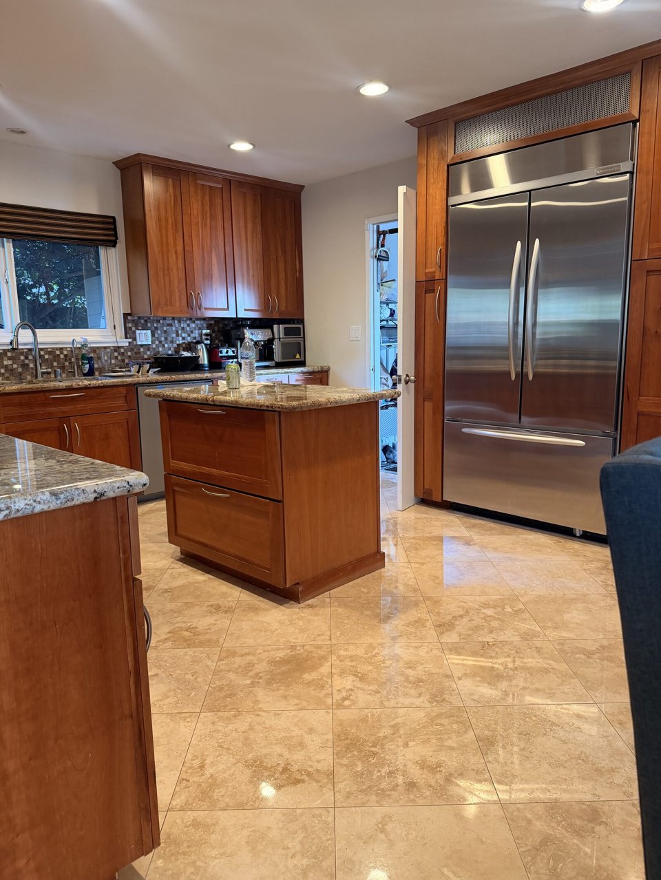 Orange County kitchen travertine floor after cleaning, honing, polishing and sealing by Titan Stone Pros