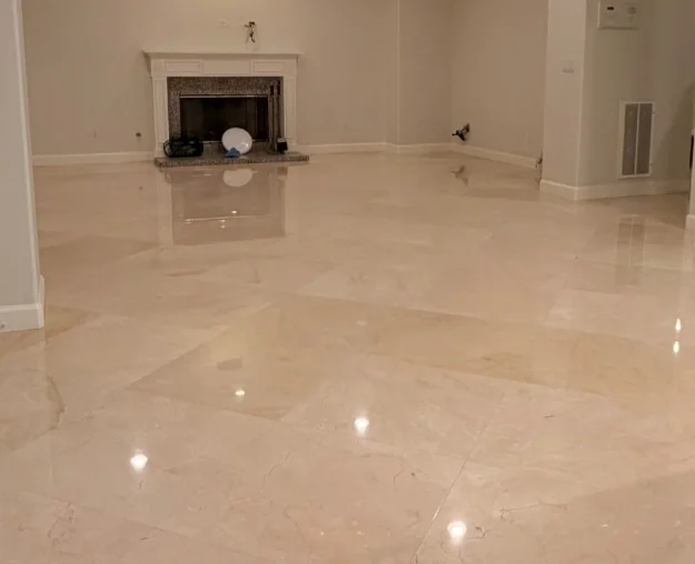Polished stone tile floor reflecting the living room lights