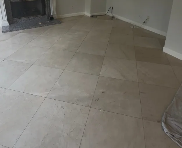 The same living room stone floor before polishing, dull and flat