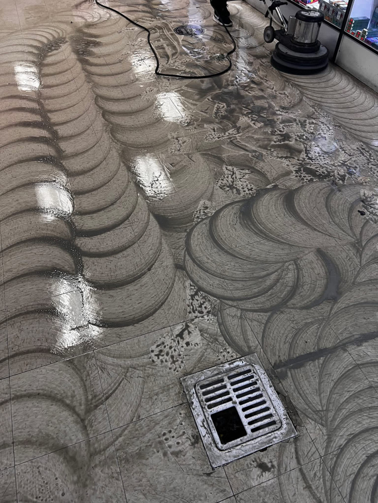 Commercial hard-surface floor during machine cleaning