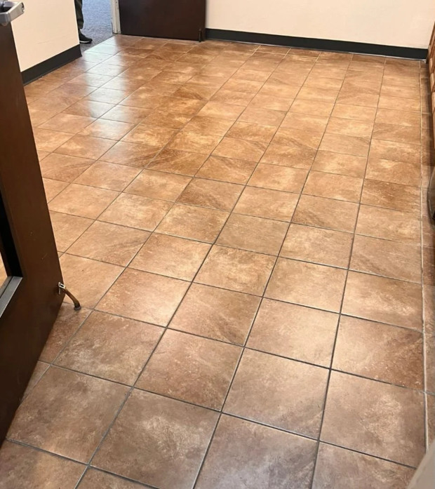 The same tile and grout floor before restoration